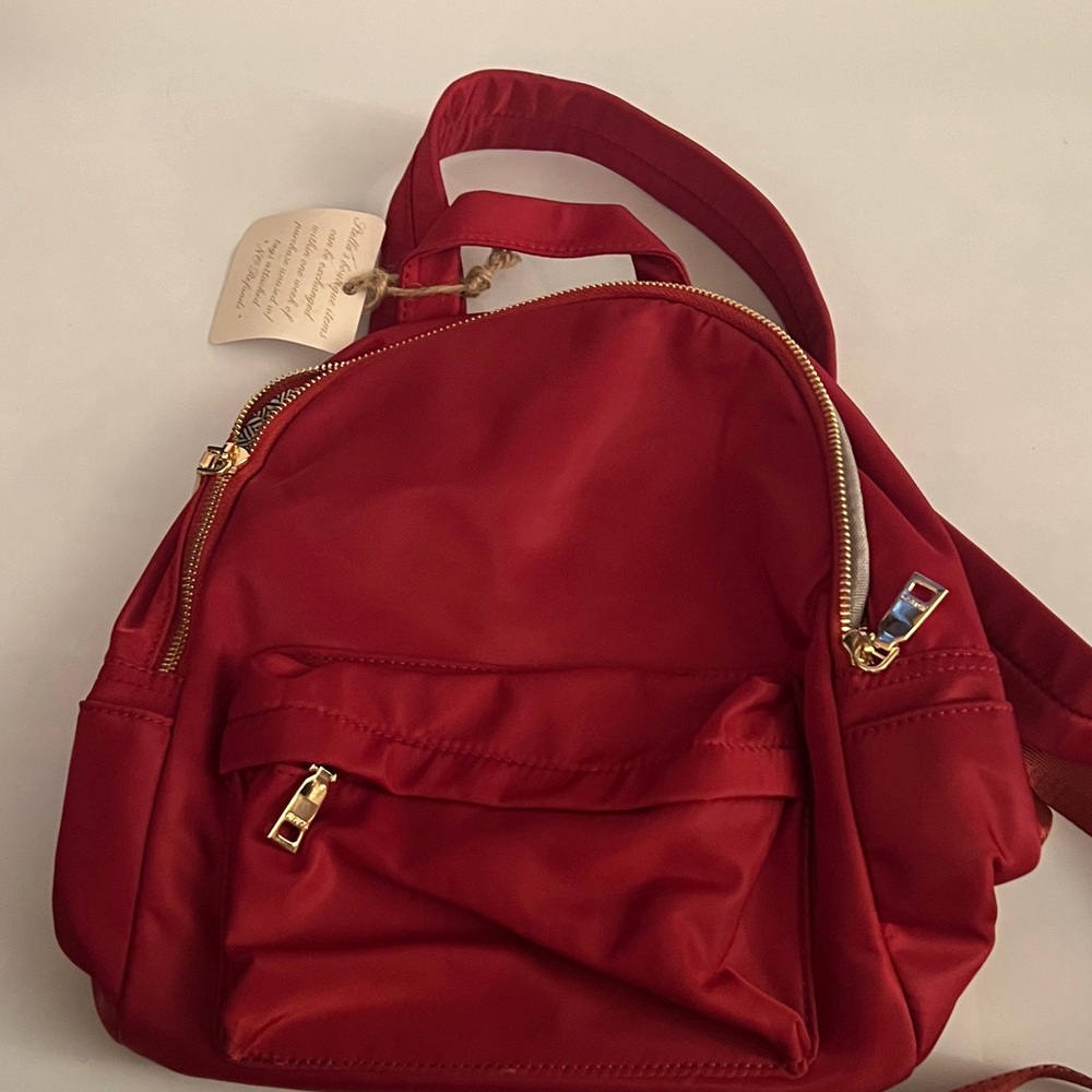 Chic Red Backpack with Gold Accents
